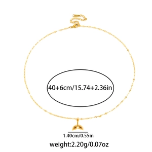 Detailed view of a gold whale tail pendant necklace with dimensions and weight specs
