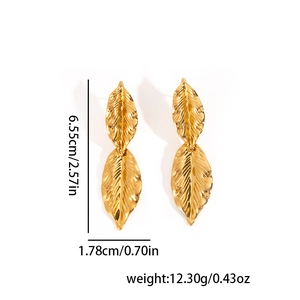 Detail showing 18k gold plated leaf earrings with size measurements and weight info