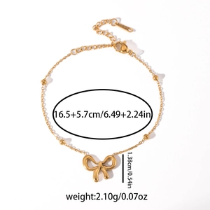 Detailed view of golden bow bracelet with dimensions 16.5 plus 5.7cm and lobster clasp