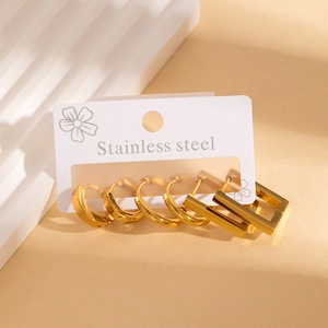 Detailed set of 6 gold stainless steel earrings on a display card with various textures