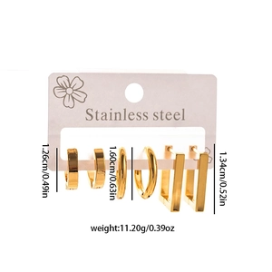 Detailed set of three golden stainless steel earrings on display card with product specs