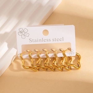 Detail view of 6-piece golden stainless steel wavy geometric hoop earrings set