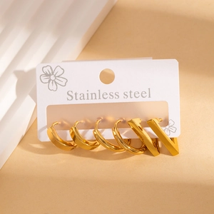 Detail of 6-piece gold stainless steel geometric hoop earring set on display card