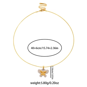 Detail of gold butterfly pendant with sparkling cubic zirconia inlay and 40cm chain size