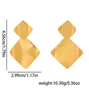 Detailed view of matte gold diamond-shaped earrings with specific dimensions and weight