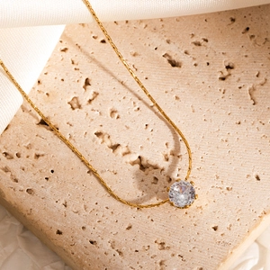 Elegant gold snake chain necklace with round brilliant cut solitaire diamond pendant