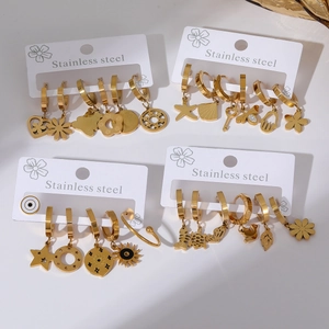 Detailed set of gold-plated stainless steel earrings featuring heart and celestial charms