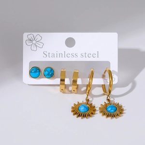 Detailed set of 3 stainless steel earrings including sunflower charms and blue stones