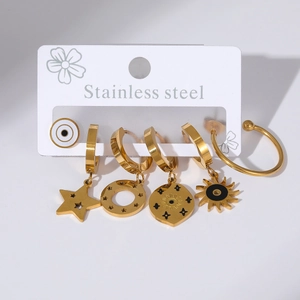 Detailed set of gold stainless steel earrings and ring featuring celestial sun and star charms