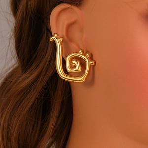 Polished gold titanium steel spiral ear cuff featuring small decorative beads