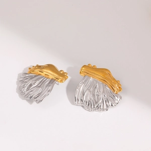 Detailed view of two-tone 18K gold plated earrings with textured silver fan design