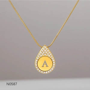 Luxury gold letter A pendant necklace with teardrop crystal halo and delicate chain link