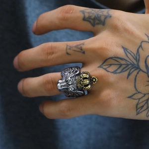 Retro punk lion head ring with gold crown detail in polished titanium steel for men