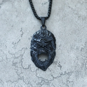 Detailed close-up of a black punk gorilla pendant with realistic fur texture on stone