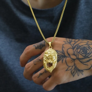 Detailed close-up of a gold Sun Wukong Monkey King pendant with punk crown details