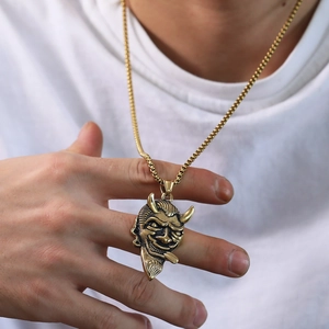 Retro bull demon pendant in gold-tone steel featuring intricate horn and fang details
