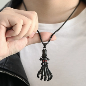 Punk skeleton hand claw pendant in black finish with red stone skull eyes for men