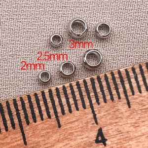Macro view of 18K gold plated positioning beads in 2mm, 2.5mm and 3mm sizes