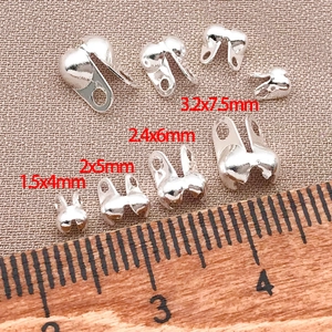 Detailed size comparison of silver DIY bead tips and calottes for jewelry making