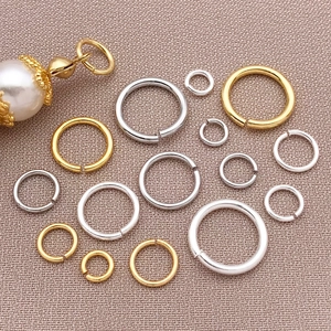 Mix of 18k gold plated and silver jump rings in various sizes for DIY jewelry making