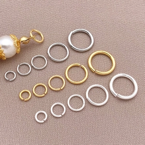 18k gold plated open jump rings in various sizes for DIY jewelry making and connectors
