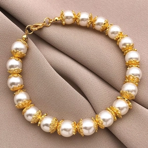 Elegant 18k gold plated pearl bracelet with vintage hollow flower caps and lobster clasp