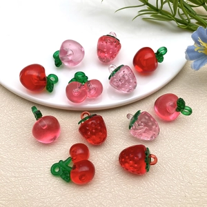Translucent resin fruit pendants featuring strawberries and cherries for DIY jewelry making