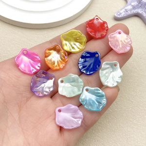 Detailed close-up of iridescent acrylic camellia petals with pre-drilled DIY holes