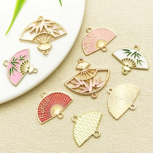 Detailed view of Chinese style fan pendants with bamboo patterns and colorful enamel