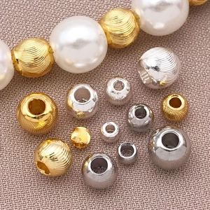 Mix of 18k gold plated spiral beads and white faux pearls for DIY jewelry making