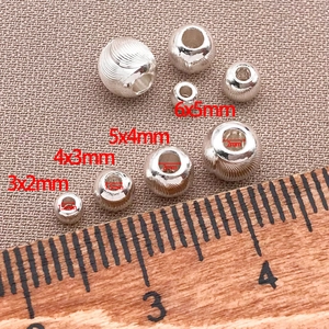 Silver DIY metal beads with spiral textures and size measurements for jewelry making