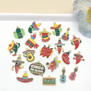 Flat lay detail of Mexican Fiesta enamel charms including cactus and sombrero