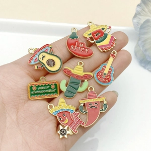 Detail of colorful Mexican Fiesta DIY charms featuring chili, avocado, and guitar elements