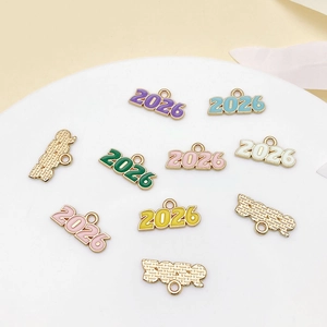 Macro detail of colorful enamel 2026 year charms for DIY jewelry making accessories