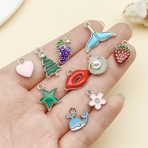 Macro shot of colorful enamel alloy charms including heart and star for DIY jewelry making