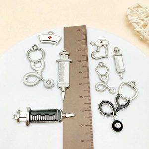 Silver medical charm set including stethoscope, syringe, and nurse cap for DIY jewelry