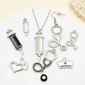 Medical themed enamel jewelry charms set including stethoscope and nurse hat pendants