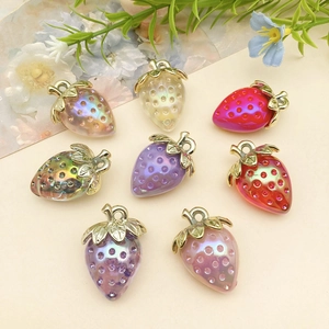Set of 8 colorful acrylic strawberry charms with iridescent finish and golden leaf loop