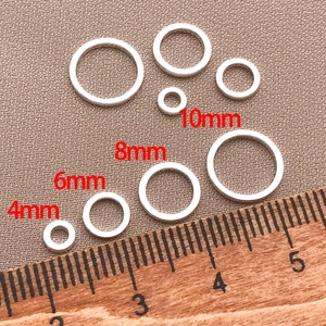 Detail view of silver metal jump rings in 4mm to 10mm sizes for jewelry making