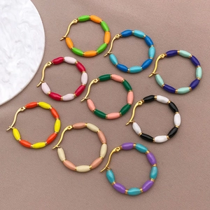 Detailed collection of colorful enamel bamboo hoop earrings in nine various color combinations