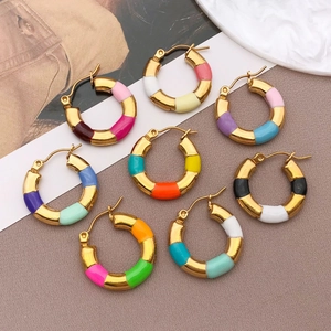 Detail view of gold-plated bamboo hoop earrings with multi-colored enamel drip oil finish
