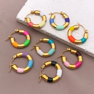 Detailed macro view of colorful enamel bamboo hoop earrings set in premium gold plating