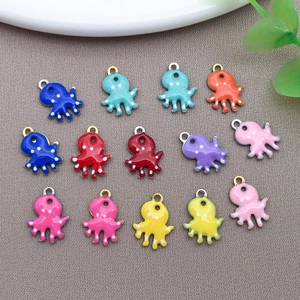 Polished stainless steel octopus pendants with colorful enamel drips and white polka dots