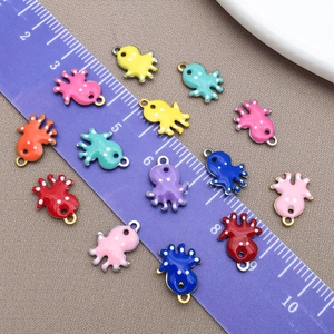Detailed view of colorful octopus charms in enamel finish with measurement ruler