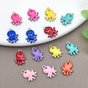 Macro detail of colorful octopus charms with enamel finish for DIY jewelry making