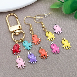 Macro shot of colorful enamel octopus charms for DIY jewelry making and keychains