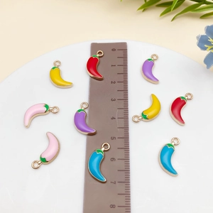 Detailed macro view of colorful enamel chili charms for DIY jewelry accessories