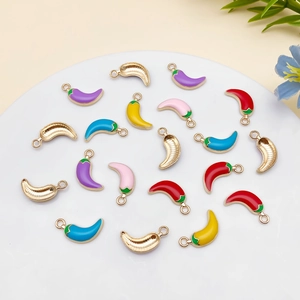 Macro shot of colorful enamel chili pepper alloy charms for DIY jewelry and crafts