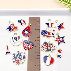 Flat lay of USA Independence Day alloy charms with July 4th motifs and measuring ruler