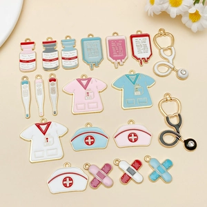 Flat lay of medical charms including stethoscopes and nurse caps for DIY jewelry